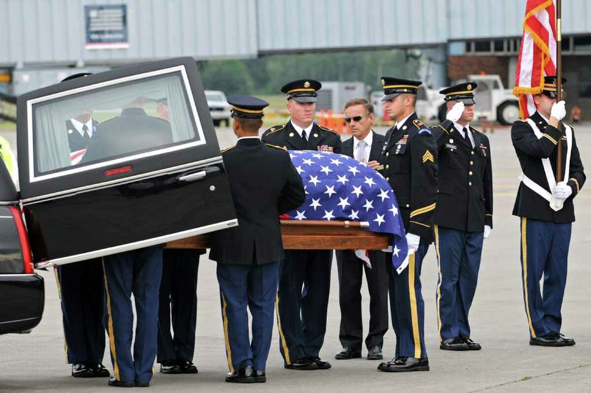 The remains of WWll Army Air Corps 1st Lt. Ray Fletcher arrives at the Albany International Airport on Wednesdasy, Aug. 18, 2010. His final destination is his hometown in Vermont. (Lori Van Buren / Times Union)