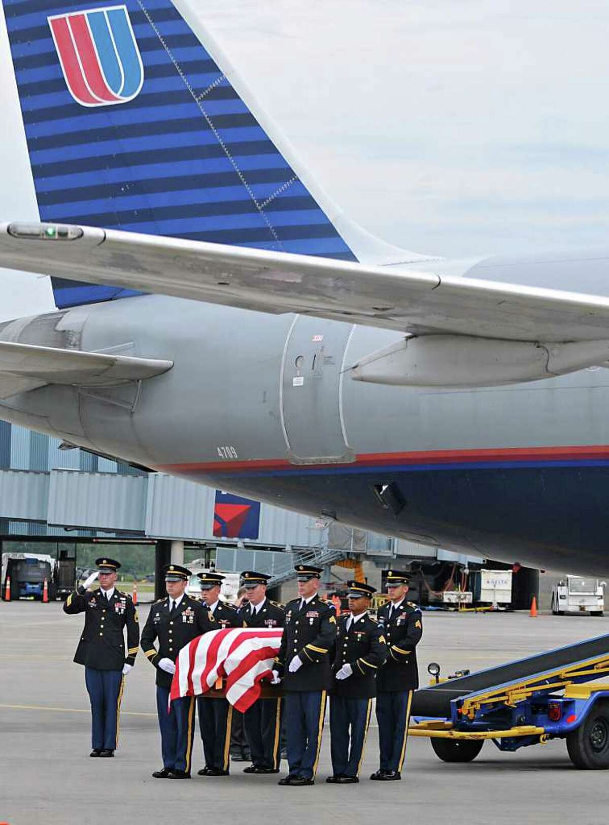 The remains of WWll Army Air Corps 1st Lt. Ray Fletcher arrives at the Albany International Airport on Wednesdasy, Aug. 18, 2010. His final destination is his hometown in Vermont. (Lori Van Buren / Times Union)