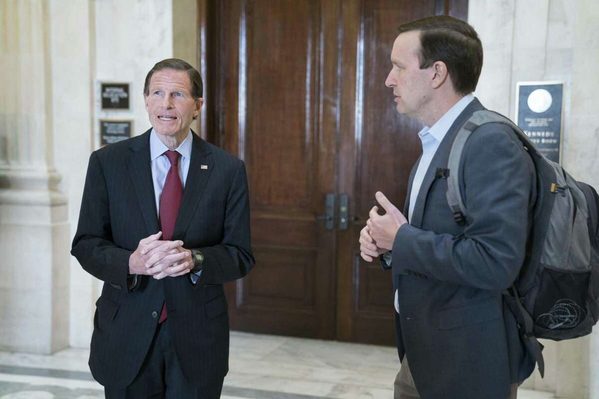 Senators Richard Blumenthal, left, and Chris Murphy, Democrats from Connecticut, depart from a Democratic caucus meeting in the Russell Senate Office Building in Washington, D.C., U.S., on Sunday, March 22, 2020. The latest draft of Senate Republicans' rescue package has swollen with hundreds of billions in additional spending, including more aid for the poor, the unemployed and health care, but Majority Leader Mitch McConnell has yet to win the agreement of House Speaker Nancy Pelosi and Senate Minority Leader Chuck Schumer. Photographer: Sarah Silbiger/Bloomberg