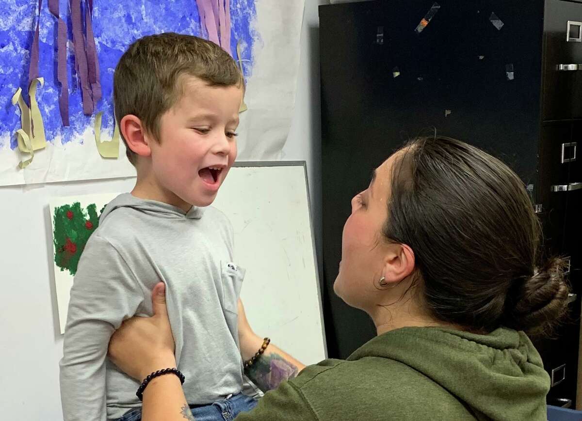 Tucker Zimmerman receives speech therapy from Elisa Isabella-Valenzi of the Communication Clinic of Connecticut