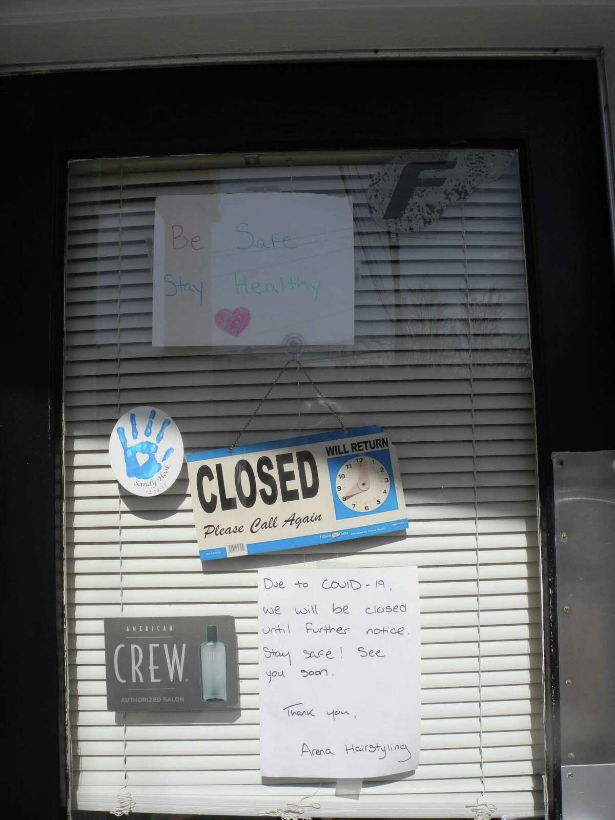 The “closed” sign at Arena Hairstyling is indicative of some, but not all Wilton businesses.