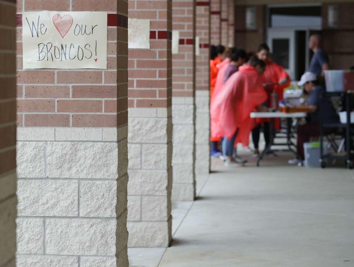 A sign is seen as teachers, faculty and staff distribute packets of schoolwork and supplies to students at Bozman Intermediate School, Friday, March 20, 2020, in Conroe. The effort is part of Conroe ISD?•s plan to educate students remotely as schools remain close because of the coronavirus pandemic.