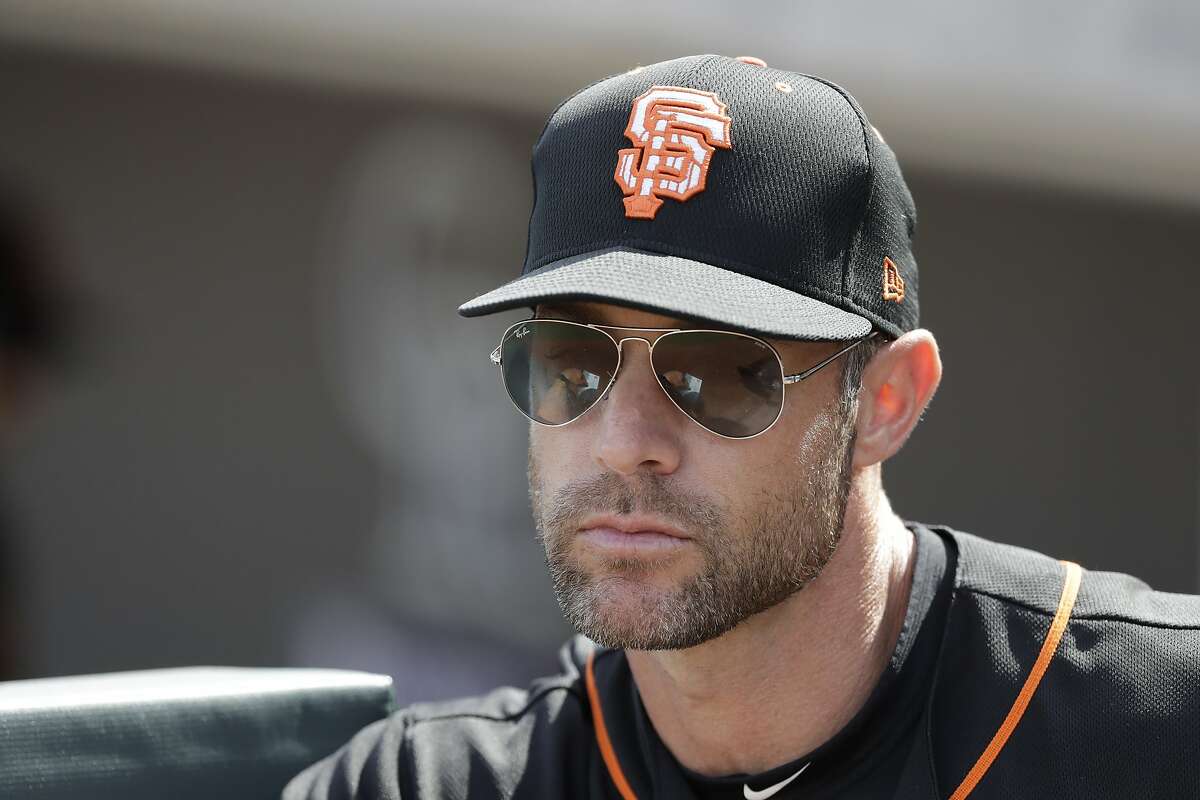 DETROIT, MI - AUGUST 24: San Francisco Giants manager Gabe Kapler (19)  walks back to the mound after a pitching change during the Detroit Tigers  versus the San Francisco Giants on Wednesday