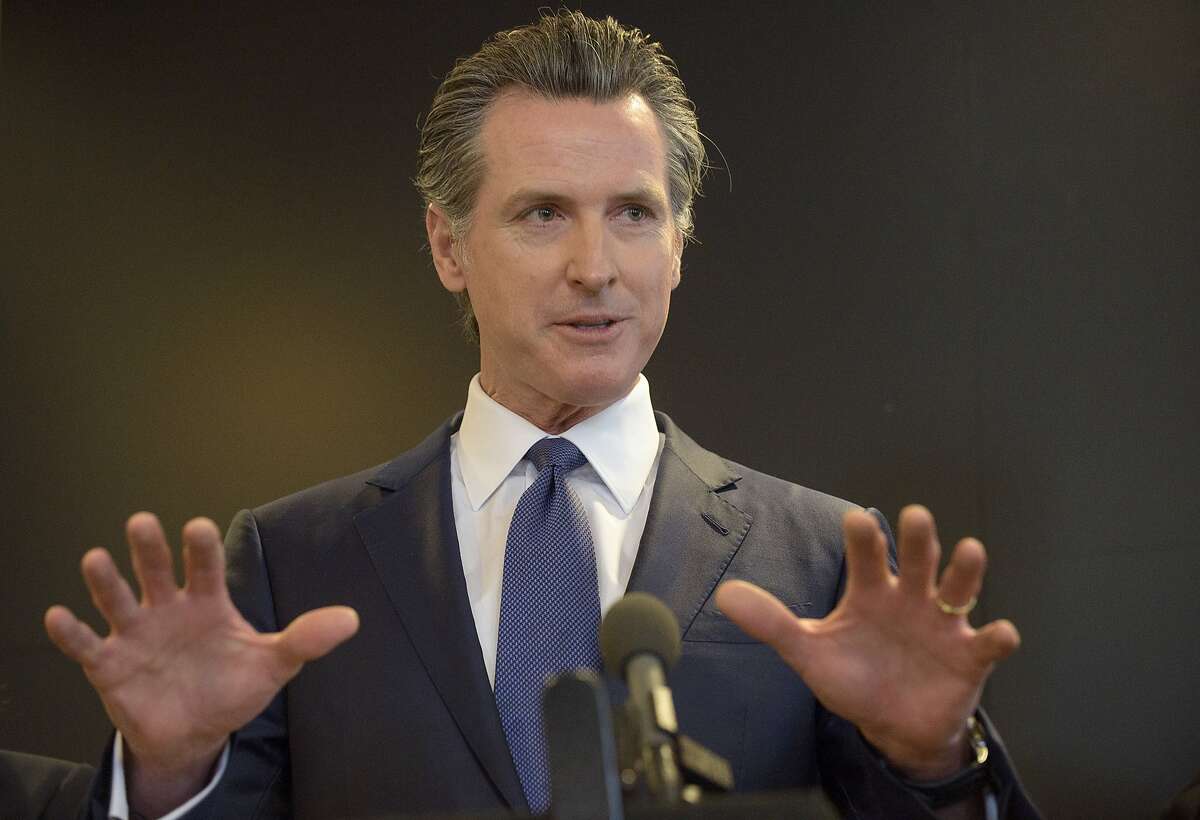 California Governor Gavin Newsom speaks to members of the press at a news conference in Sacramento, Calif., Thursday, Feb. 27, 2020. Newsom spoke about the state's response to novel coronavirus, also known as COVID-19. Yesterday, the Centers for Disease Control and Prevention confirmed a possible first case of person-to-person transmission of COVID-19 in California in the general public.(AP Photo/Randall Benton)