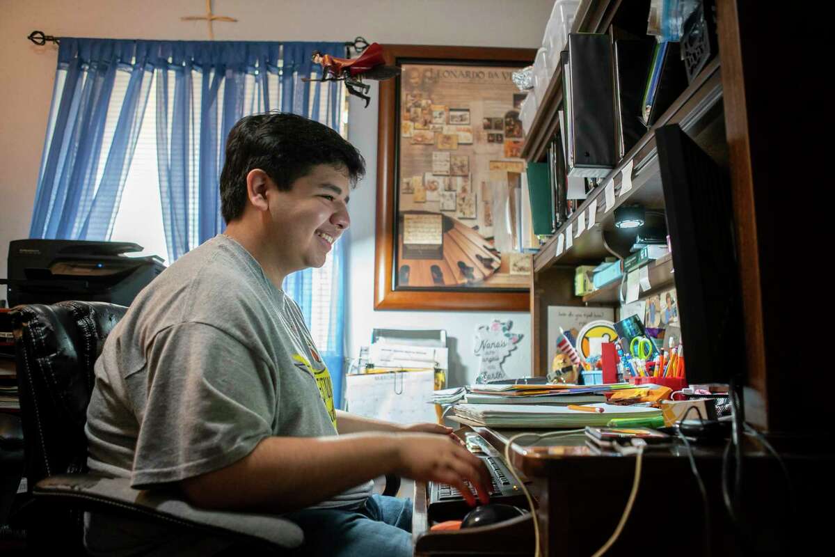 Luis Abetes, 18, participates in a virtual math class March 23 from his home in Missouri City.