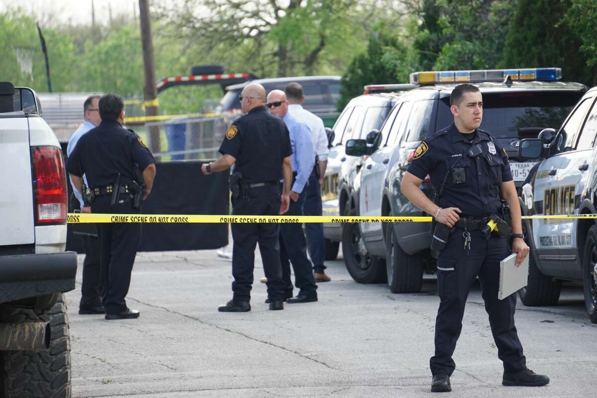 San Antonio Police investigators examine the scene where a man was killed during a confrontation with an officer Monday afternoon, March 23, 2020, on the West Side. The man, in his 40s, confronted the officer with a pickaxe when she arrived at the scene, police said.