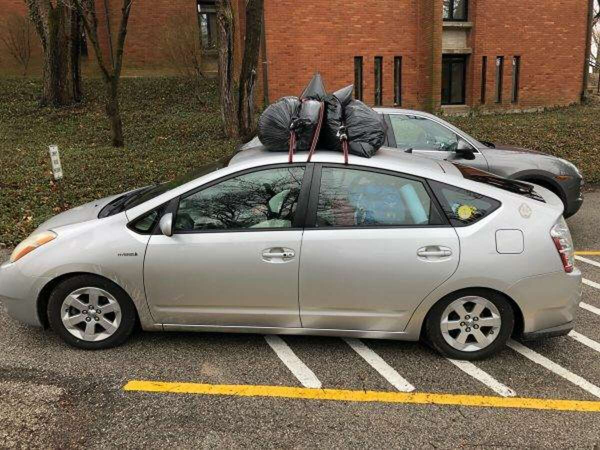 During a 23-hour-long journey across nine states in his sister’s super-packed Prius transformed by weight into a lowrider, Principia College senior Sam Hills drove sophomore Rachel McLeod-Warrick and her older brother, senior Matthew, back to Cape Cod, Mass. last weekend. Photo by Sam Hills