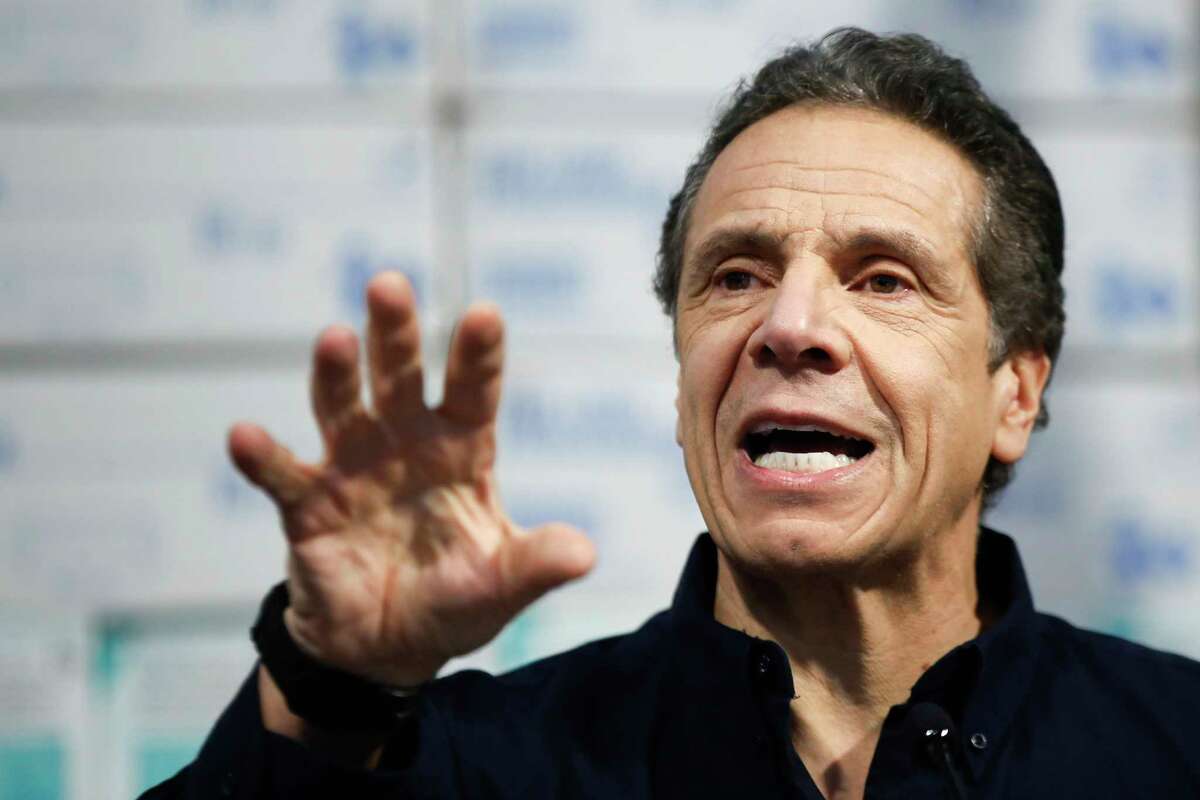 New York Gov. Andrew Cuomo speaks during a news conference against a backdrop of medical supplies at the Jacob Javits Center that will house a temporary hospital in response to the COVID-19 outbreak, Tuesday, March 24, 2020, in New York. Cuomo sounded his most dire warning yet about the coronavirus pandemic, saying the infection rate in New York is accelerating and the state could be as close as two weeks away from a crisis that projects 40,000 people in intensive care.