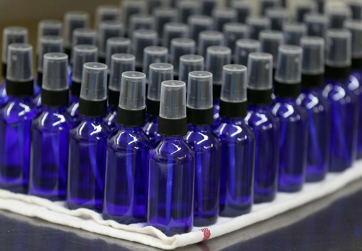 Farid Dormishian fills four ounce bottles with hand sanitizer at his Falcon Spirits distillery in Richmond, Calif. on Tuesday, March 24, 2020. Dormishian suspended production of the spirits during the coronavirus pandemic. The hand sanitizer will be distributed to municipalities like Berkeley and first responders.