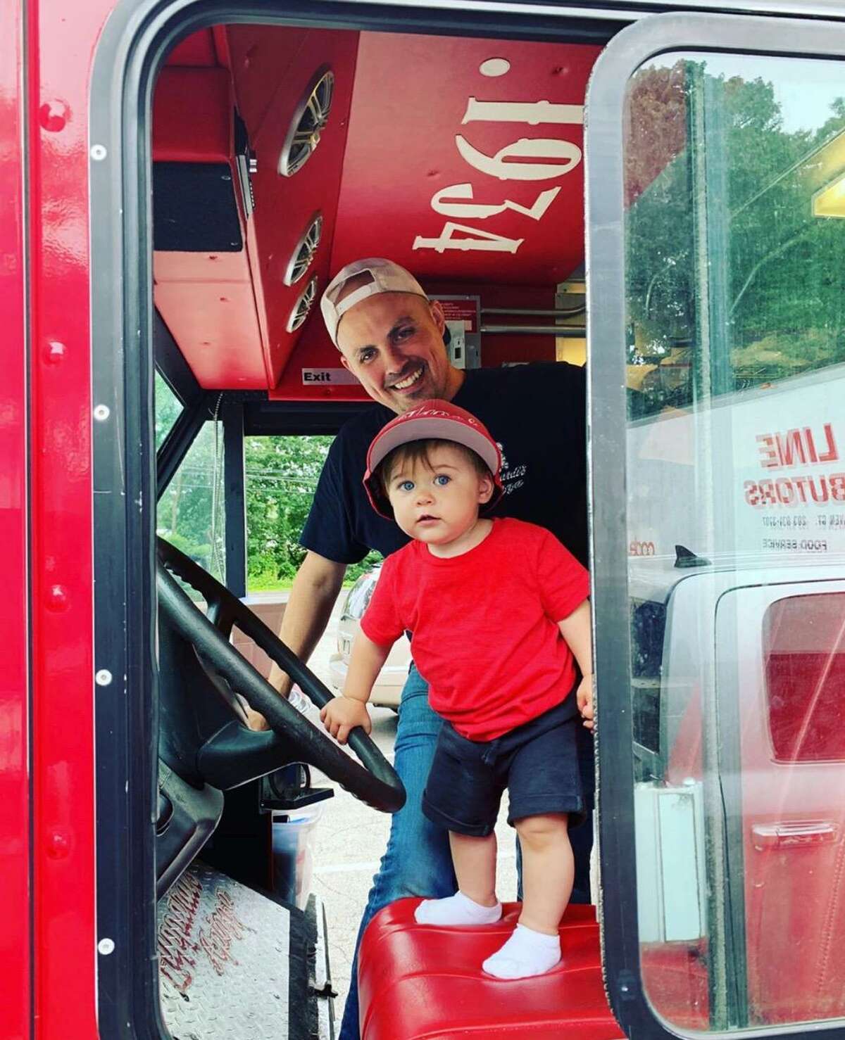 Jimmy Ormrod, of Zuppardi’s Apizza, who runs a satellite location from The Hops Co. in Derby, readies his pizza truck with his son Sebastian, 2.