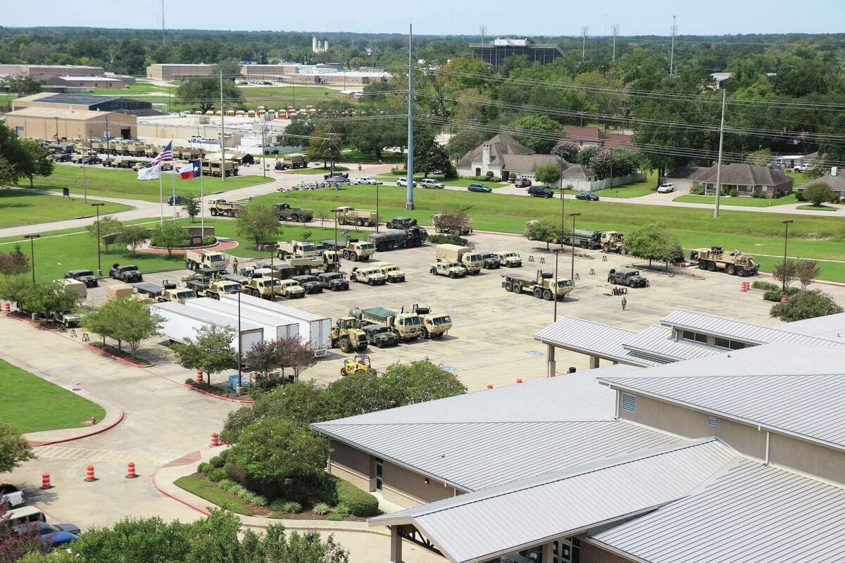 Numerous military vehicles from the Texas National Guard 636th Brigade Support Battalion were parked in the Dayton Community Center parking lot and across the street at the Dayton ISD Transportation facility for use throughout Liberty, Chambers and Jefferson counties during Hurricane Harvey recovery.