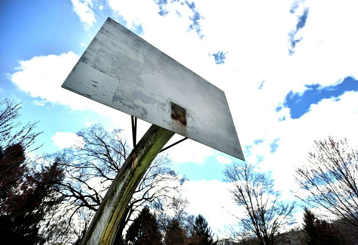 Basketball rims have been removed from the Jocelyn Square park basketball court on the corner of Humphrey Street and East Street in New Haven during the Covid-19 / coronavirus pandemic