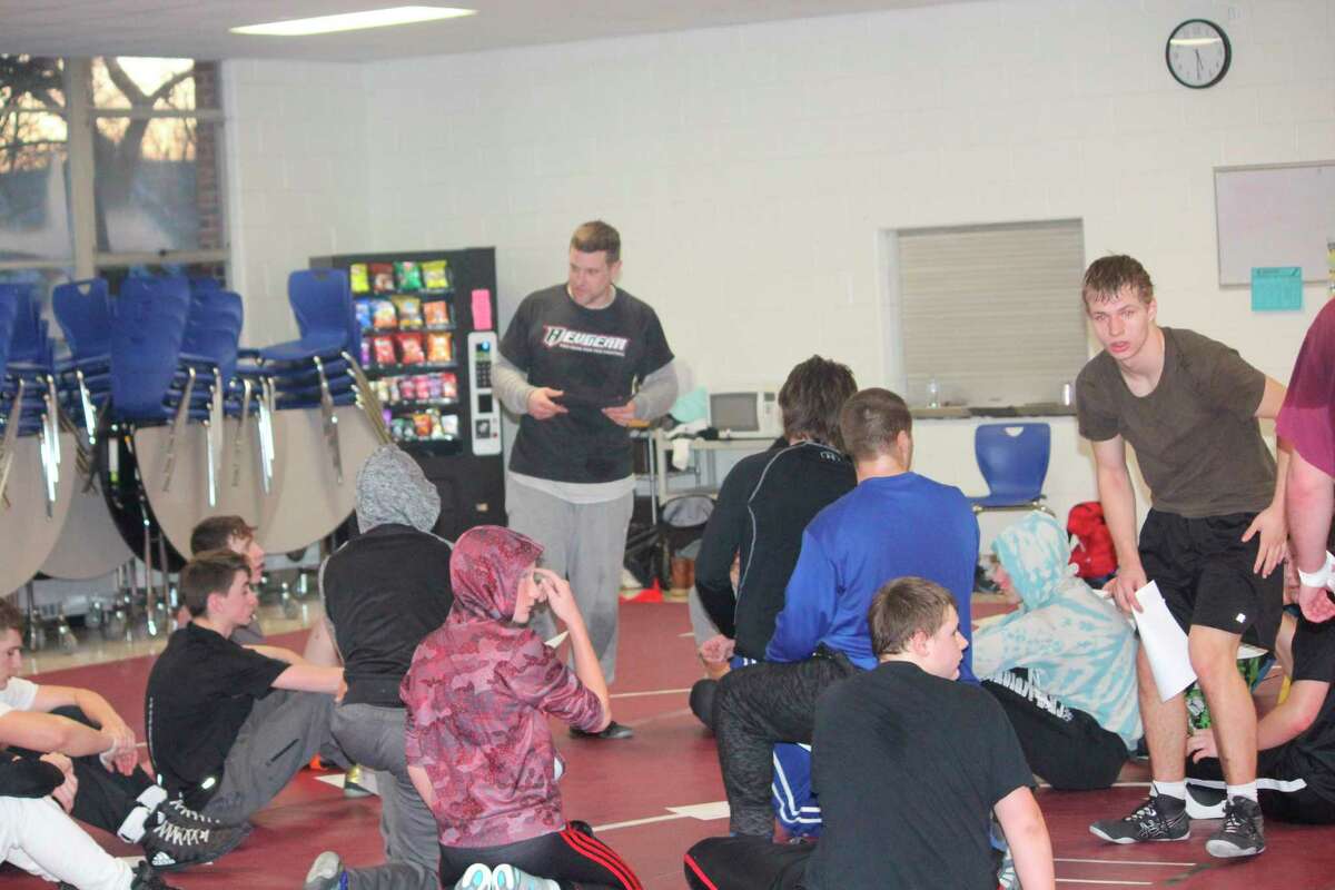 Evart wrestling coach Ben Bryant talks with his team after a practice during the season. (Herald Review file photo)