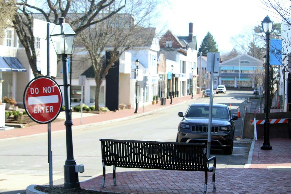 Main Street in Westport was largely empty late Tuesday afternoon with several businesses closed and restaurants doing take-out to slow the spread of the coronavirus. Taken March 24, 2020 in Westport, Conn.