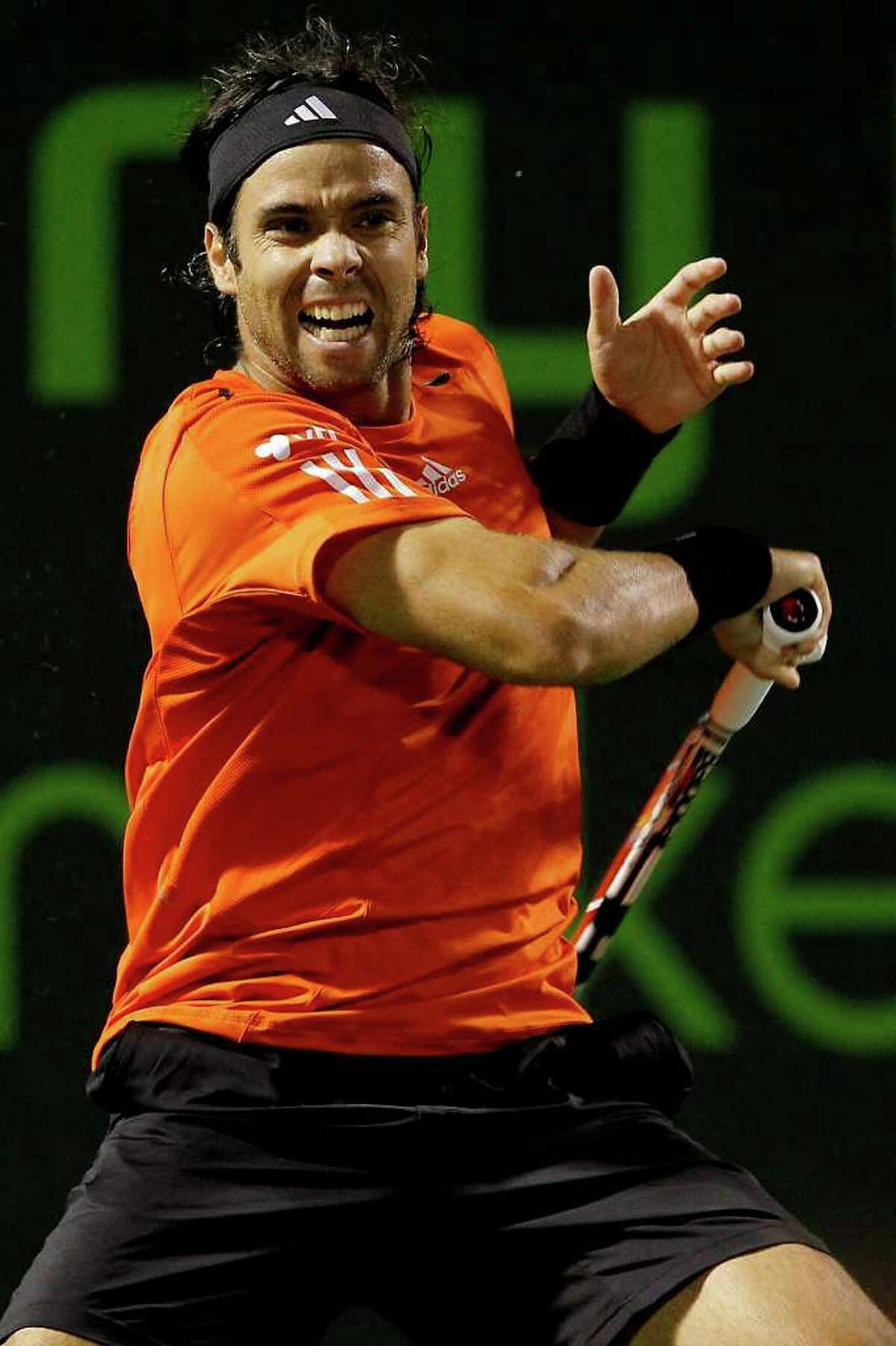 KEY BISCAYNE, FL - MARCH 29: Fernando Gonzalez of Chile returns a shot to Juan Monaco of Argentina during day seven of the 2010 Sony Ericsson Open at Crandon Park Tennis Center on March 29, 2010 in Key Biscayne, Florida. (Photo by Matthew Stockman/Getty Images) *** Local Caption *** Fernando Gonzalez