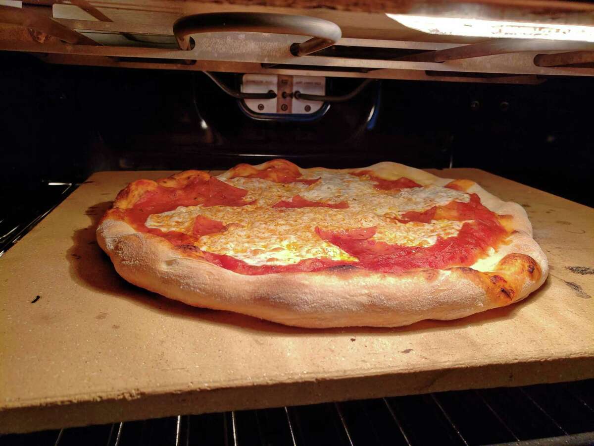 Homemade pizza ready to come out of the oven.
