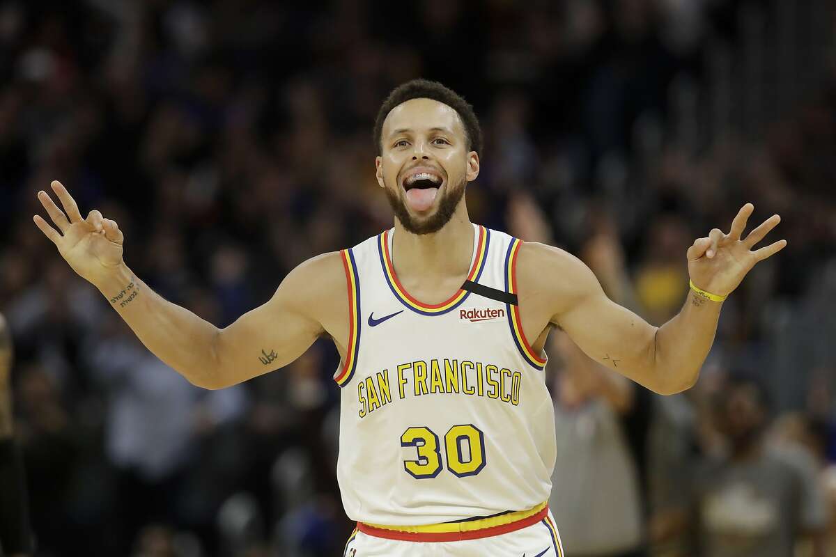Golden State Warriors guard Stephen Curry (30) celebrates after scoring against the Toronto Raptors during an NBA basketball game in San Francisco, Thursday, March 5, 2020. (AP Photo/Jeff Chiu)