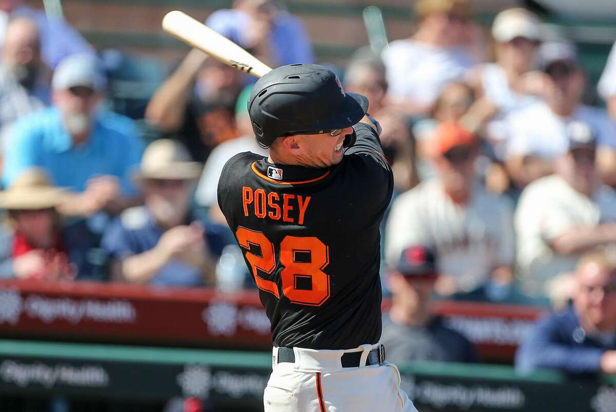 San Francisco Giants catcher Buster Posey swings during their game with the Cleveland Indians at Scottsdale Stadium Thursday, March 5, 2020, in Scottsdale, Arizona.