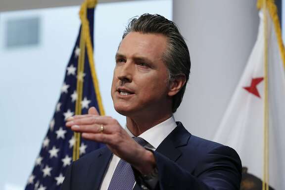 FILE - In this March 23, 2020, file photo California Gov. Gavin Newsom updates the state's response to the coronavirus, at the Governor's Office of Emergency Services in Rancho Cordova, Calif. Amid an unprecedented public health crisis, the nation’s governors are trying to get what they need from the federal government – and fast. But often that means navigating the disorienting politics of dealing with President Donald Trump. (AP Photo/Rich Pedroncelli, File)