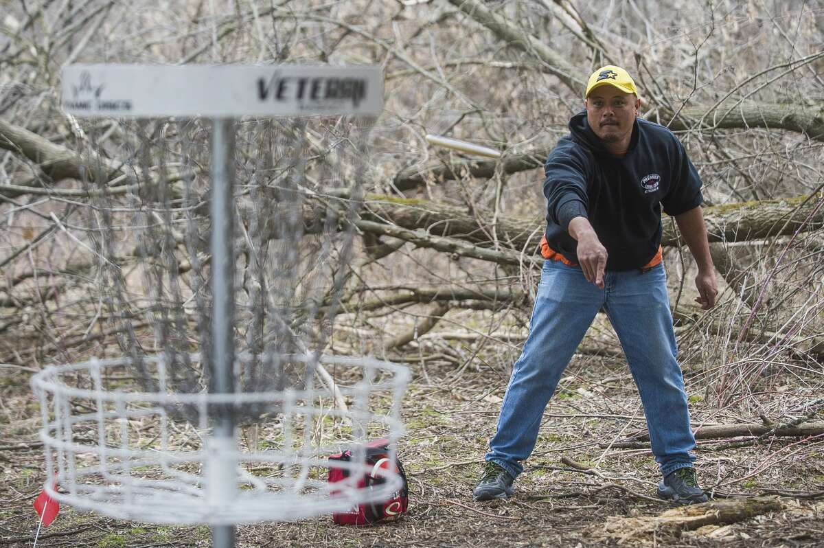 FILE — Anthony Guisbert plays a round of disc golf Thursday, March 26, 2020 at the Redcoats Softball Complex in Midland. (Katy Kildee/kkildee@mdn.net)
