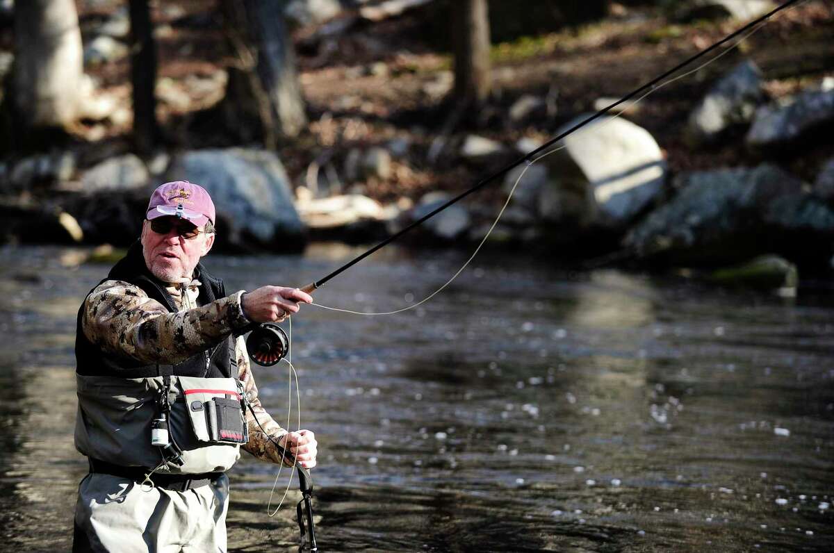 Dennis Carr of Malvern, New York casts his fly fishing rod into the waters of the Mianus River on March 26, 2020 in Stamford, Connecticut. On Tuesday, Governor Ned Lamont opened the fishing season at many lakes, ponds , rivers and streams statewide two weeks early in hopes of eliminating the large crowds that often accompany the traditional Opening Day and prevent the spread of the COVID-19 virus by social distancing according to a release from the Connecticut Fisheries Division of the state Department of Energy and Environmental Protection.