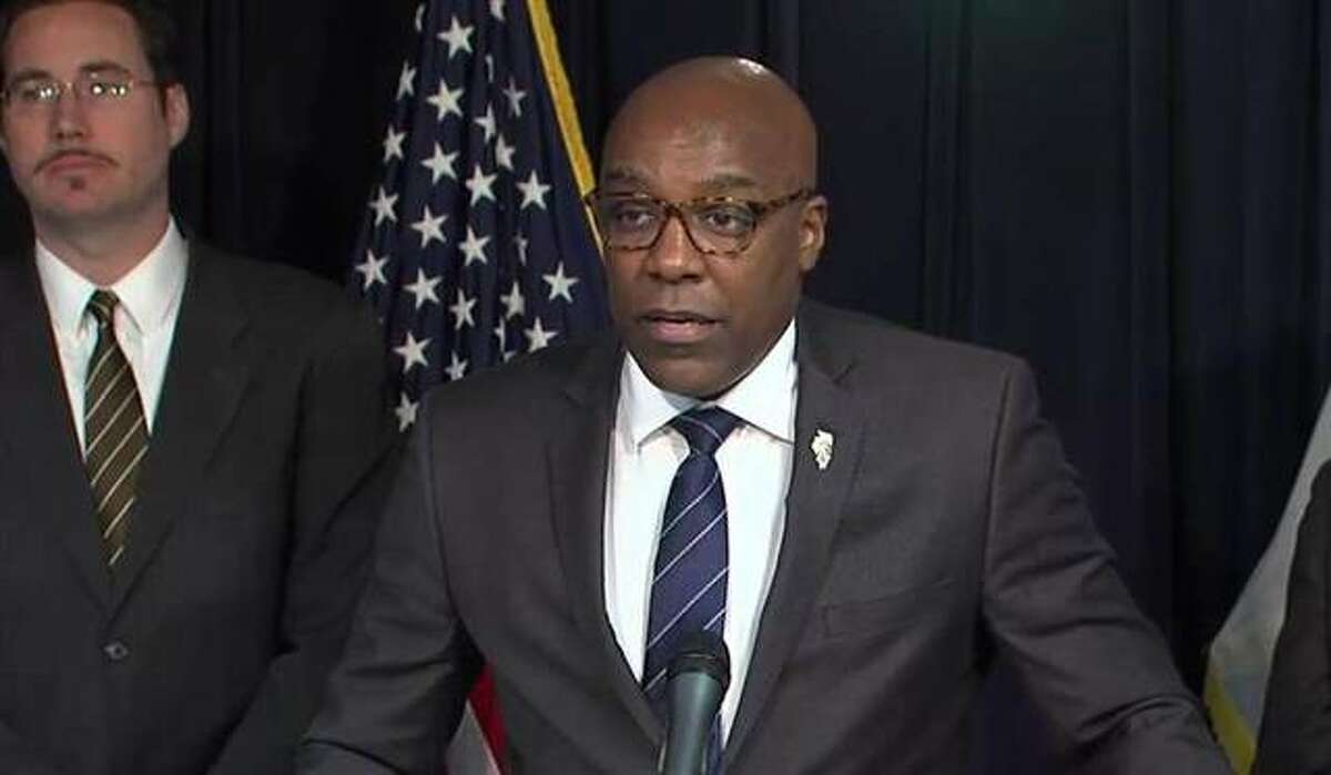 Attorney General Kwame Raoul speaks at a Chicago news conference.