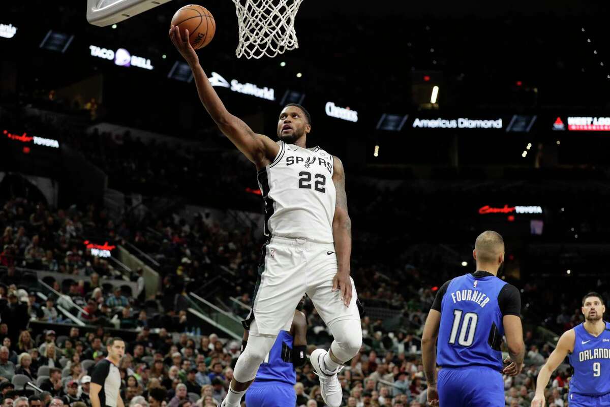 San Antonio Spurs forward Rudy Gay (22) drives to the basket against the Orlando Magic during the first half of an NBA basketball game in San Antonio, Saturday, Feb. 29, 2020. (AP Photo/Eric Gay)