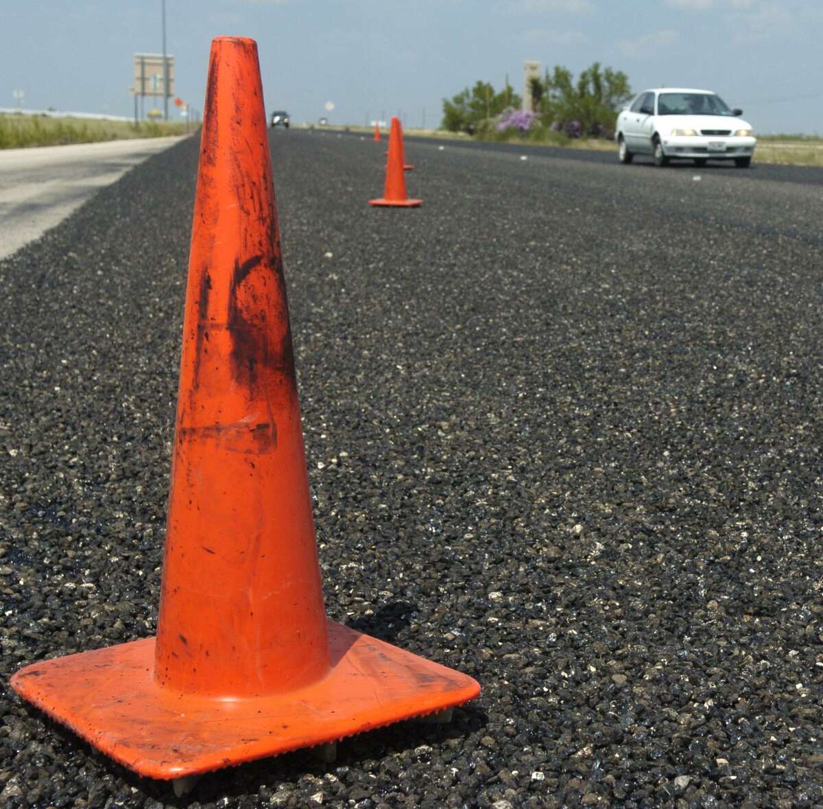 Miles of orange cones line Highway 191 limiting traffic to one lane from Midland to Odessa as TXDOT resurfaces the roadway. Photo by Tim FIscher 8/14/07