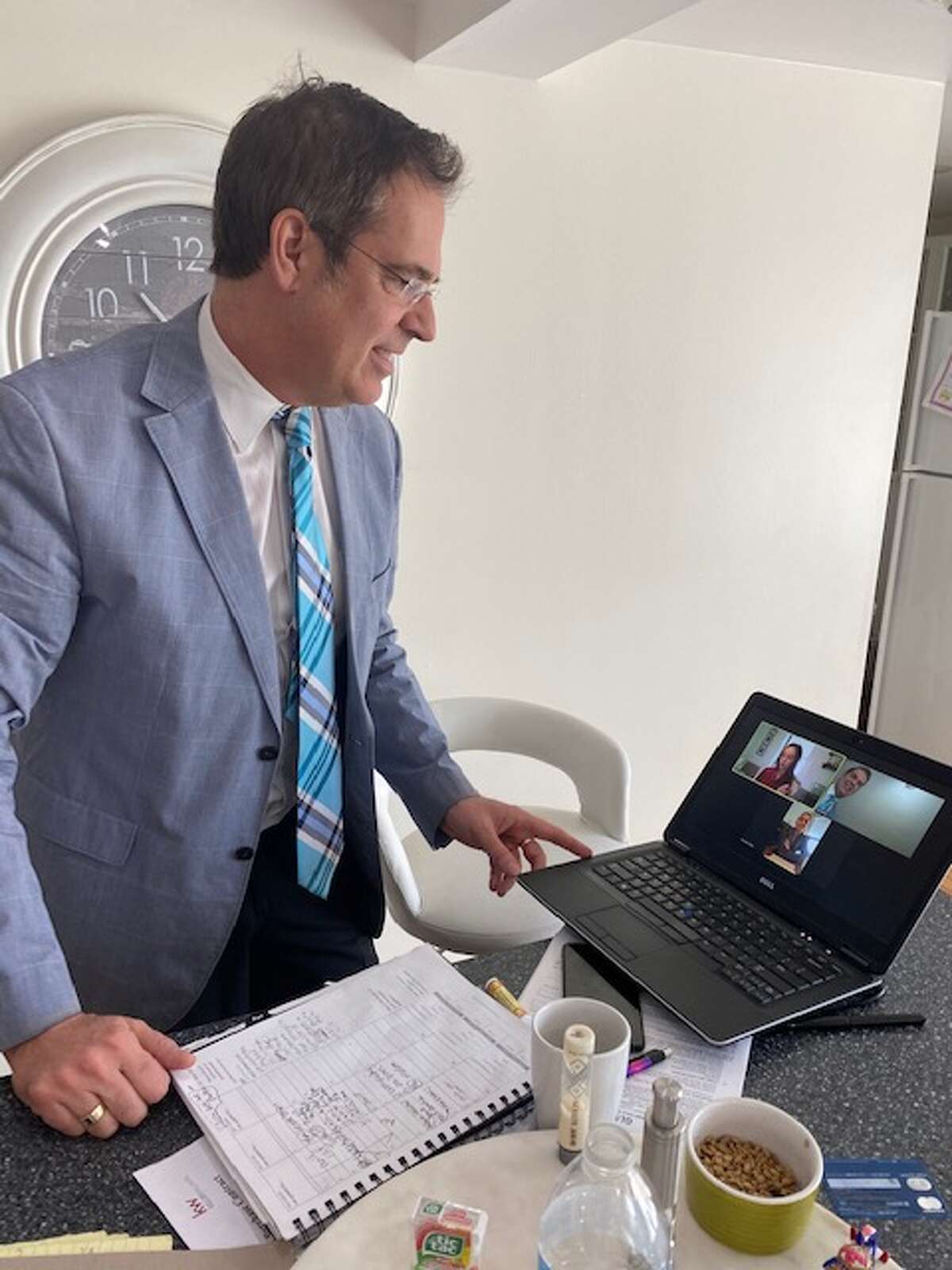 Real estate agent Scott Varley is using the video conferencing platform Zoom to meet with clients, fellow agents and staff during the coronavirus quarantine.