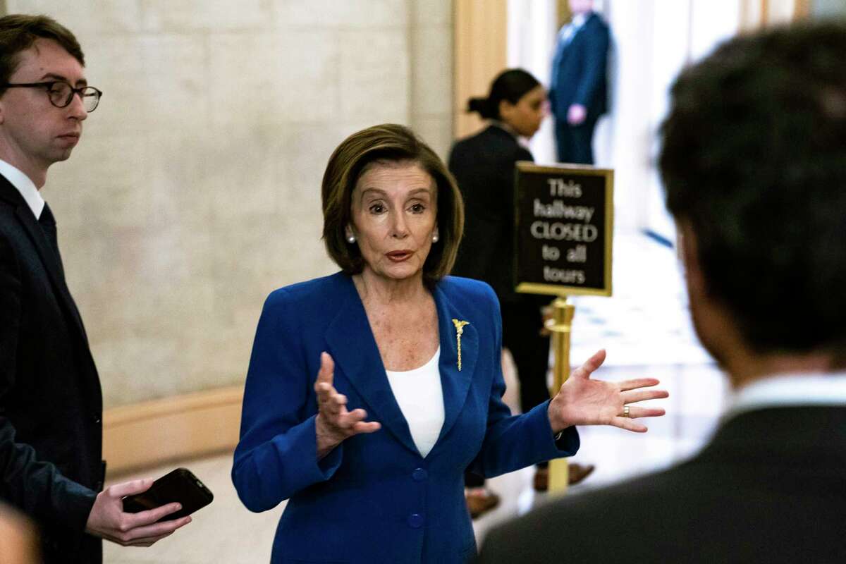 House Speaker Rep. Nancy Pelosi (D-Calif.) speaks with reporters at the Capitol in Washington, Friday morning, March 27, 2020. When members of the House return to Washington on Friday to approve a $2 trillion economic stimulus package in response to the coronavirus, and send it to President Trump, they will enter a Capitol where every facet of life has been altered by a pandemic. (Anna Moneymaker/The New York Times)