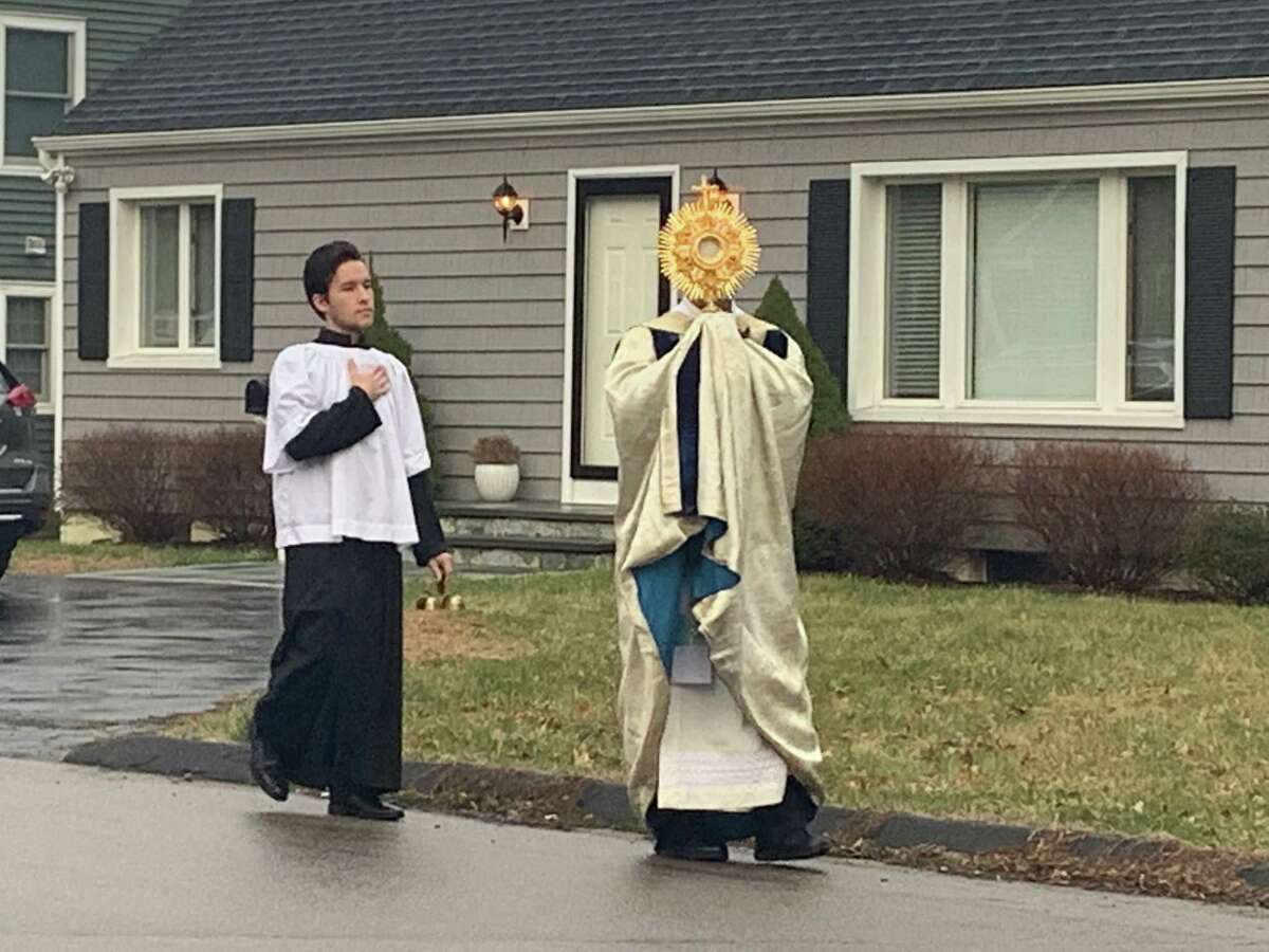 The Rev. Peter Cipriani, the 50-year-old pastor of Our Lady of the Assumption Roman Catholic parish, takes to the streets of Fairfield.