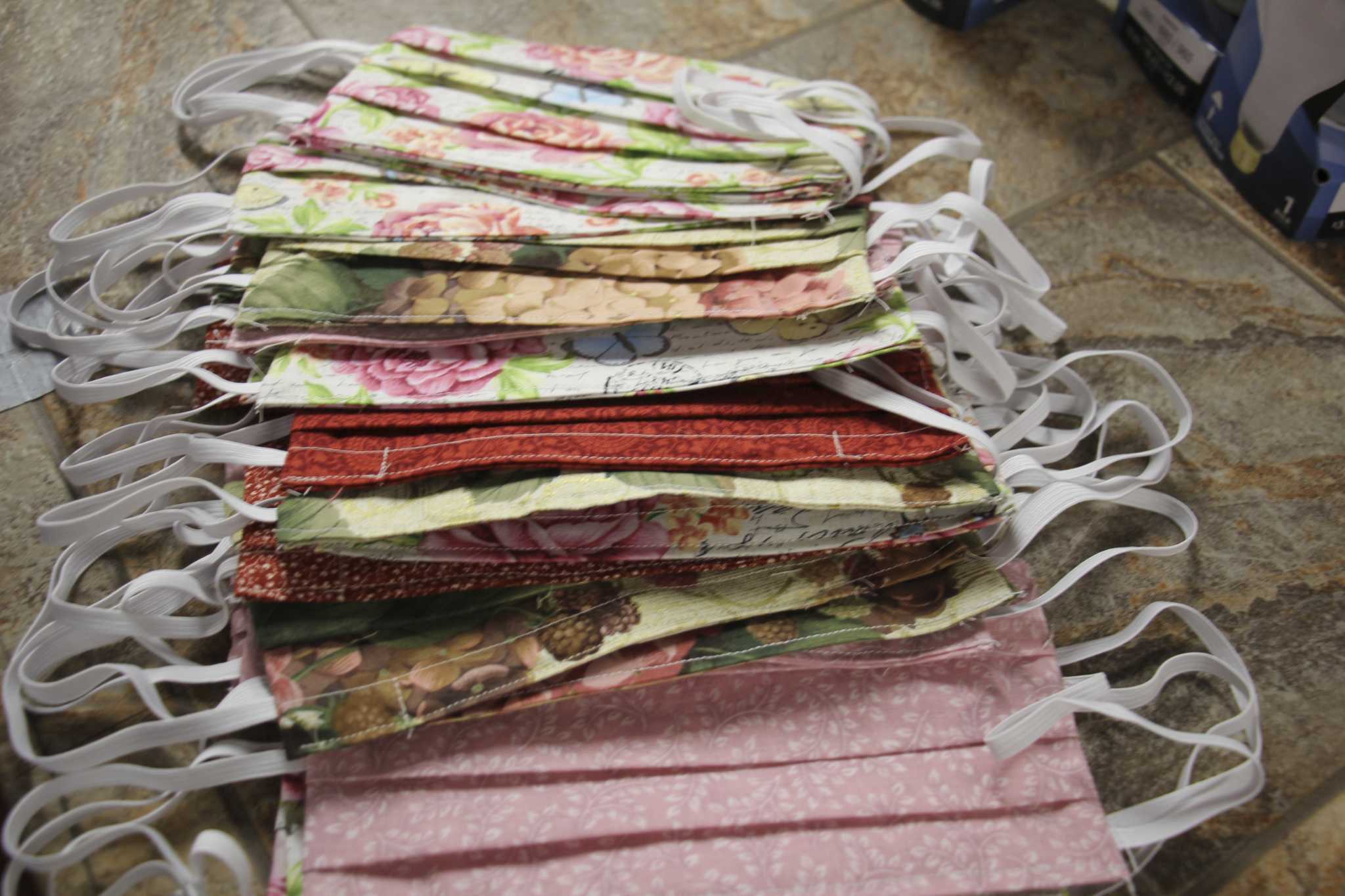 Volunteers donate face masks during shortage