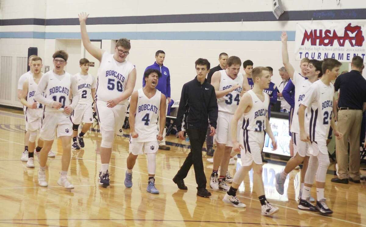 The Brethren boys basketball team thanks its home crowd after edging Onekama in a Division 4 district semifinal on March 11. The Bobcats were scheduled to face Frankfort for the district championship two nights later, but all sporting activities were suspended by the Michigan High School Athletic Association due to growing concerns over the spread of coronavirus. (News Advocate file photo)