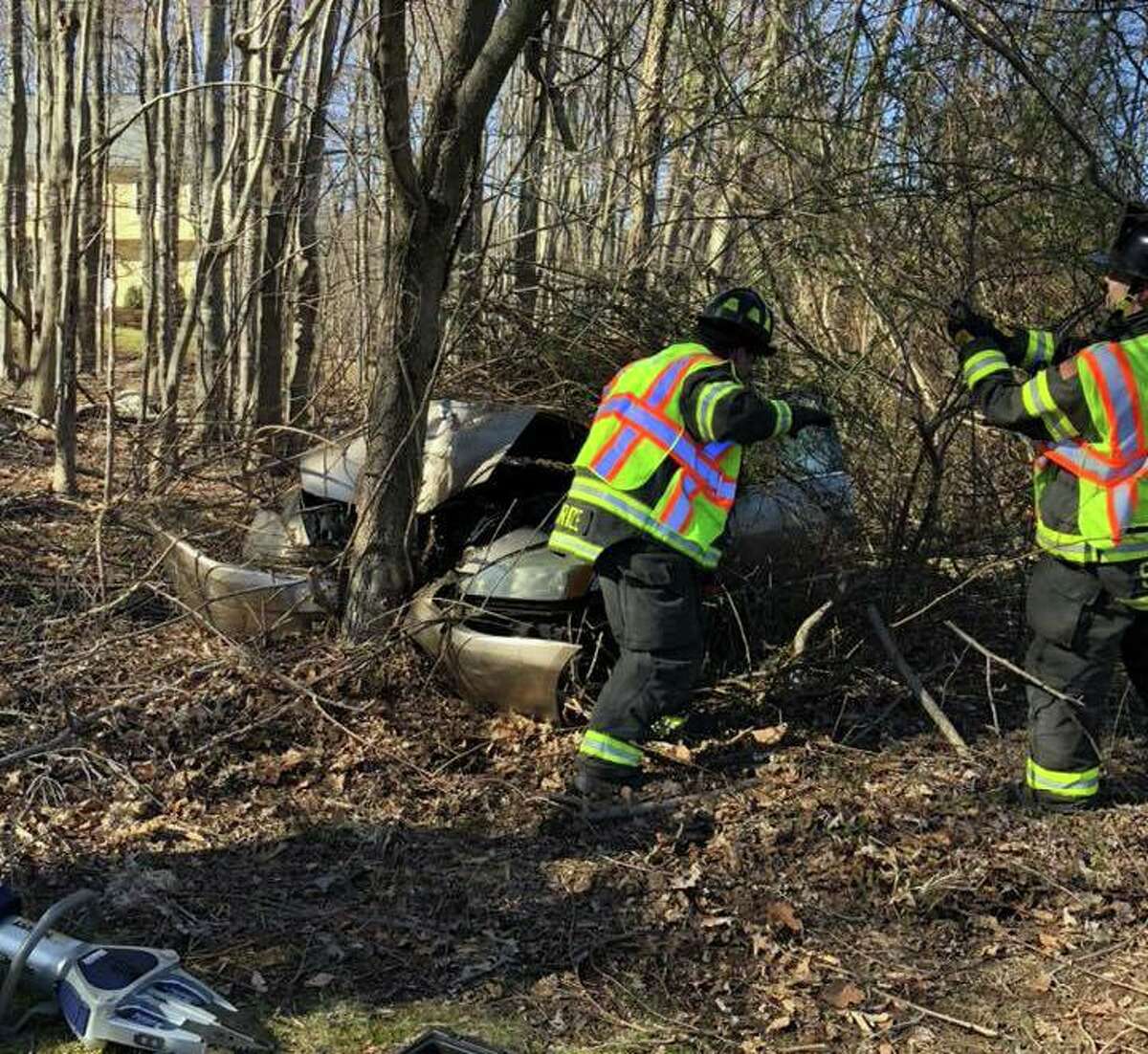 Monroe crash ends with car in woods