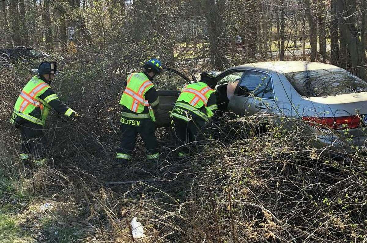 Monroe crash ends with car in woods