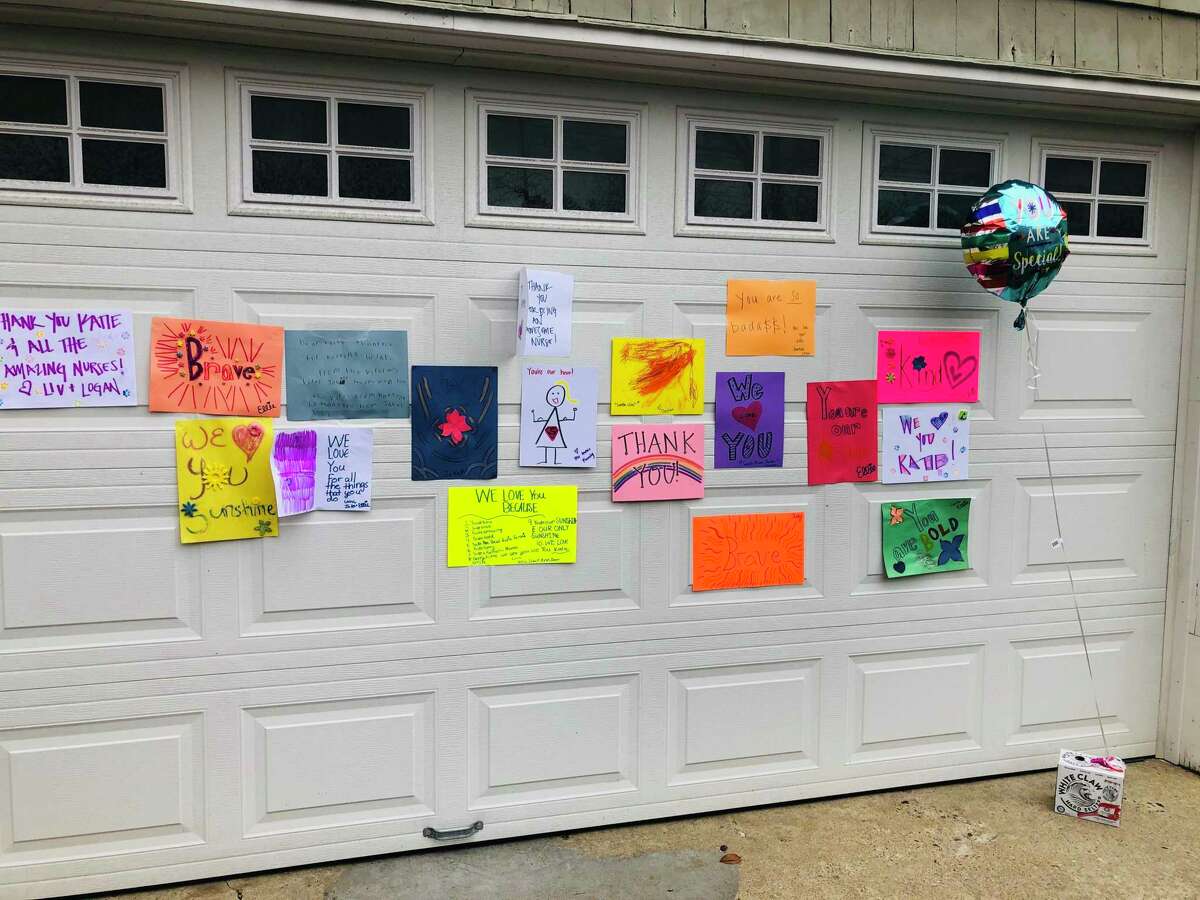 You're our hero! Neighbors surprise Darien nurse with messages of
