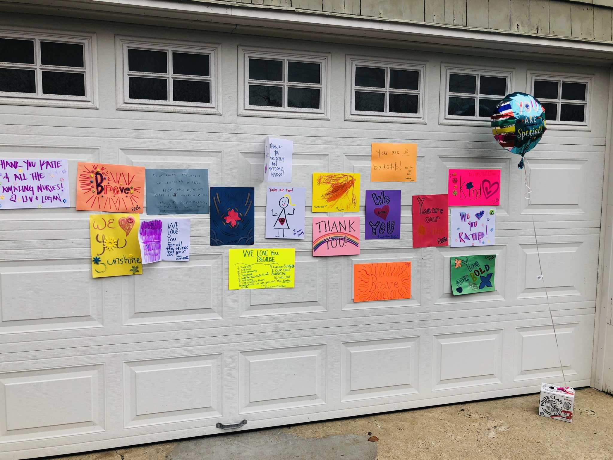 You're our hero! Neighbors surprise Darien nurse with messages of