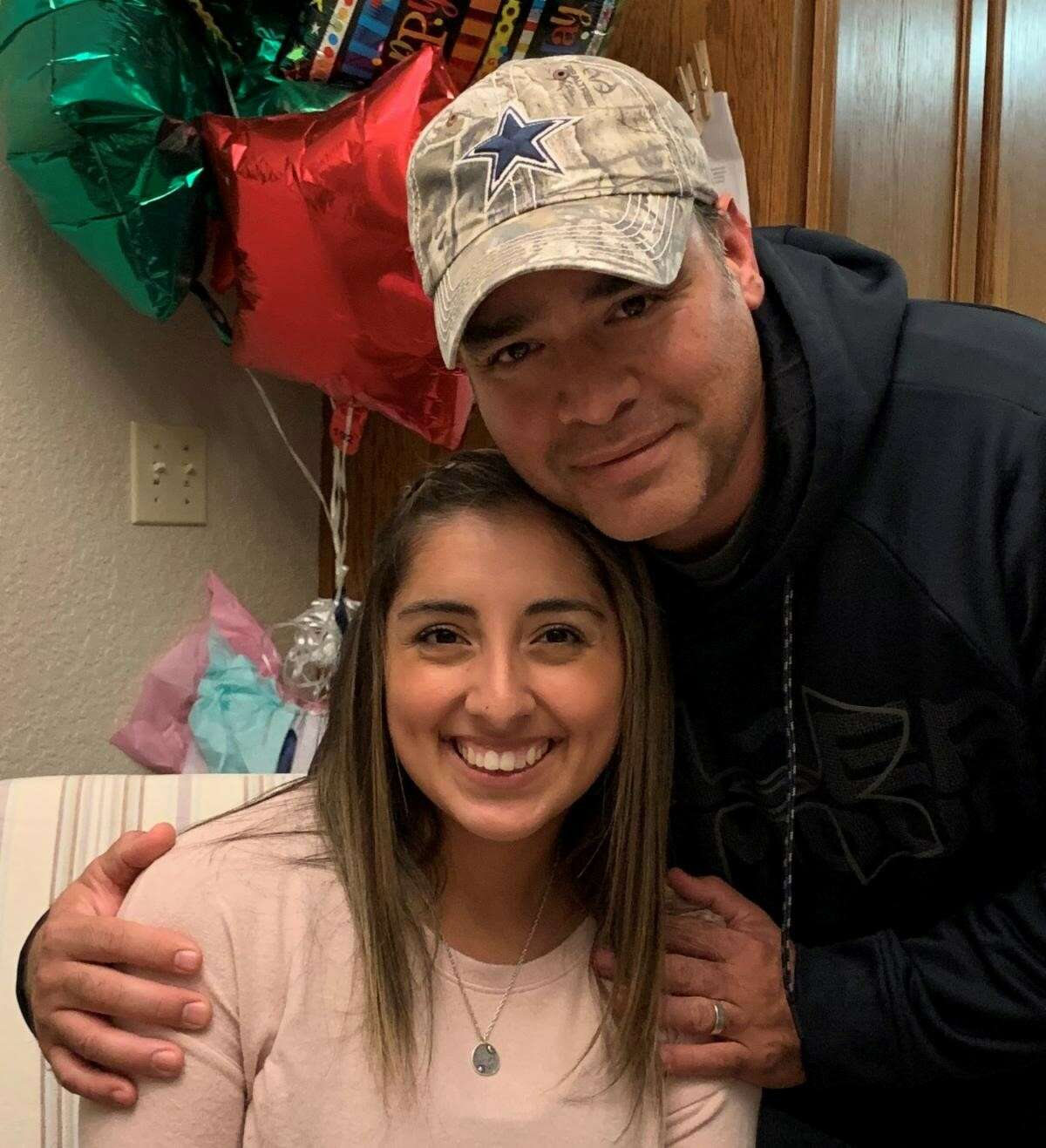 Texas A&M University-San Antonio student, Brenda Johnson, is pictured with her father Adolph "T.J." Mendez, who became Comal County's first death attributed to COVID-19, according to university and county officials.