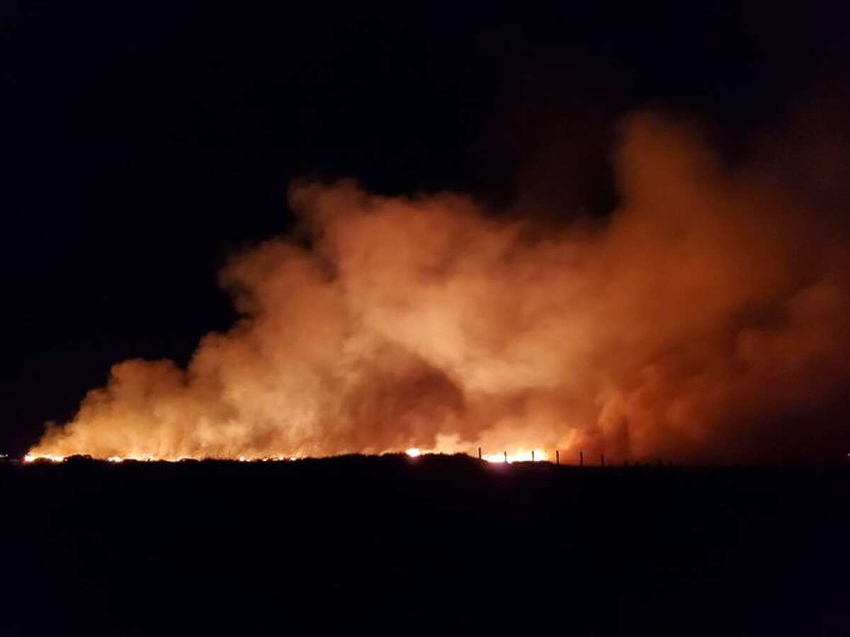 Firefighters battle large grass fire on Galveston Island's East Beach