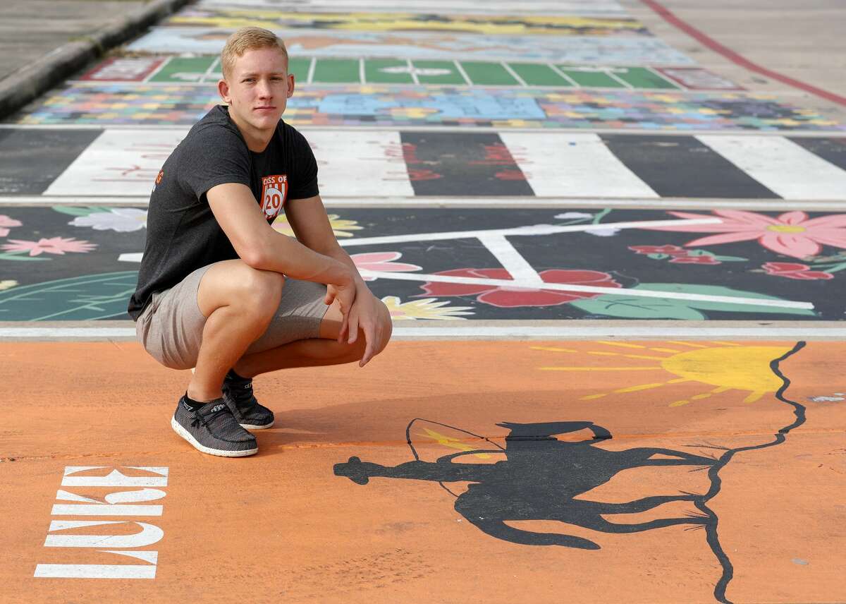 Luke McClellan poses for a portrait at his painted parking spot at Splendora High School, Thursday, March 26, 2020, in Splendora. "I can't say I'm stressed about this whole situation. It saddens me to know that we might not get to do some fun things we have looked forward to all these years, but I know there are people in much worse situations right now. I hope to still have a graduation maybe even prom. But all in all, we'll be ok. It will be a class to remember!"