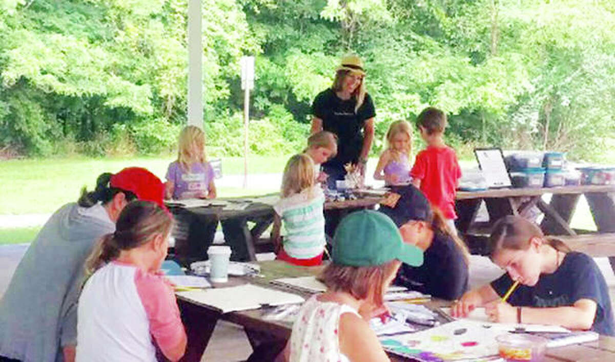 True Pure Brave Art’s Tammi (Powlen) Beck works with youngsters during a True Pure Brave Art children’s summer program. Beck founded True Pure Brave Art LLC, through which she nurtures individuals’ creativity with children’s programs and all-ages art workshops throughout the Metro East.