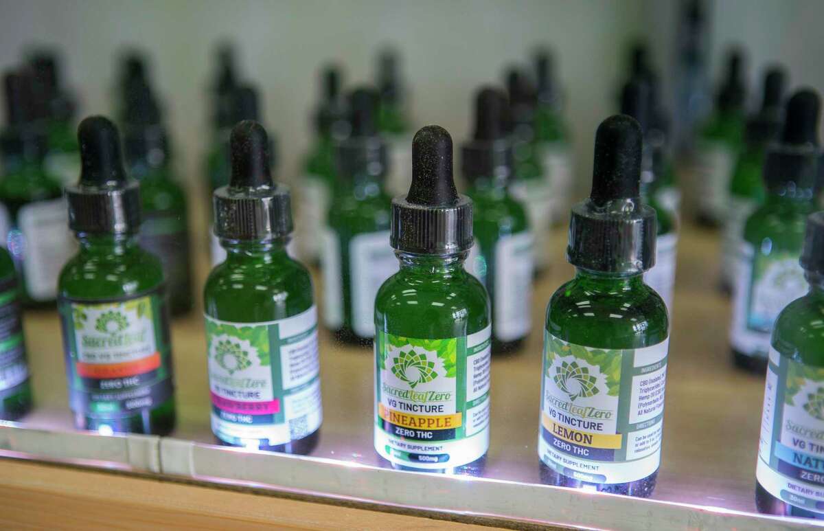 Flavored CBD tinctures fill a display case at Sacred Leaf, a store that specializes in selling products that contain CBD, in Katy, TX, Monday, July 22, 2019. CBD is legal in Texas.