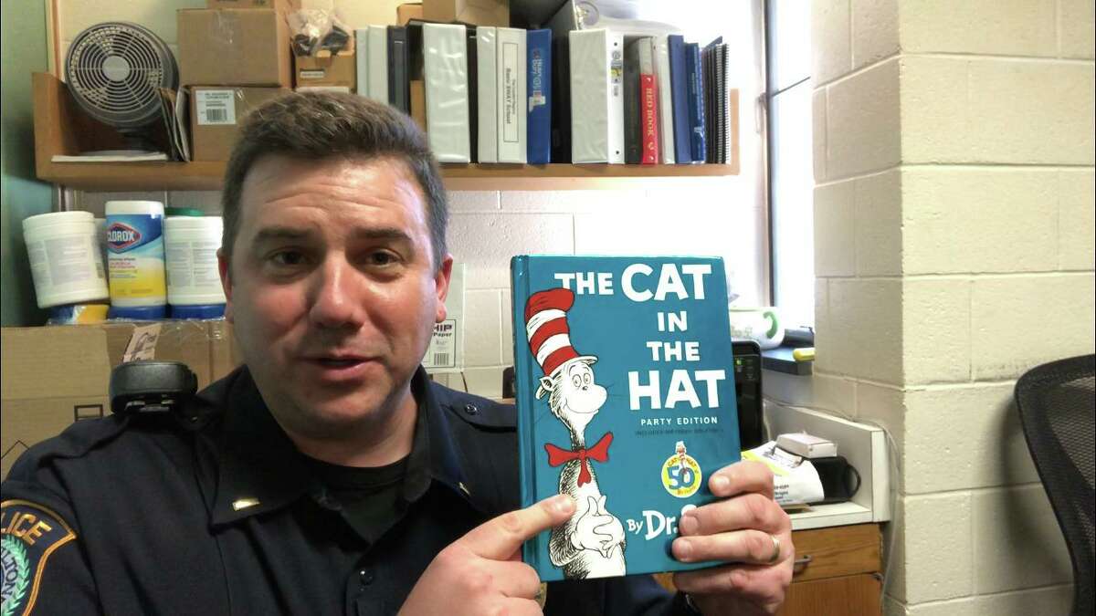 Police Lt. Dave Hartman plans to read “The Cat in the Hat” to Wilton children.