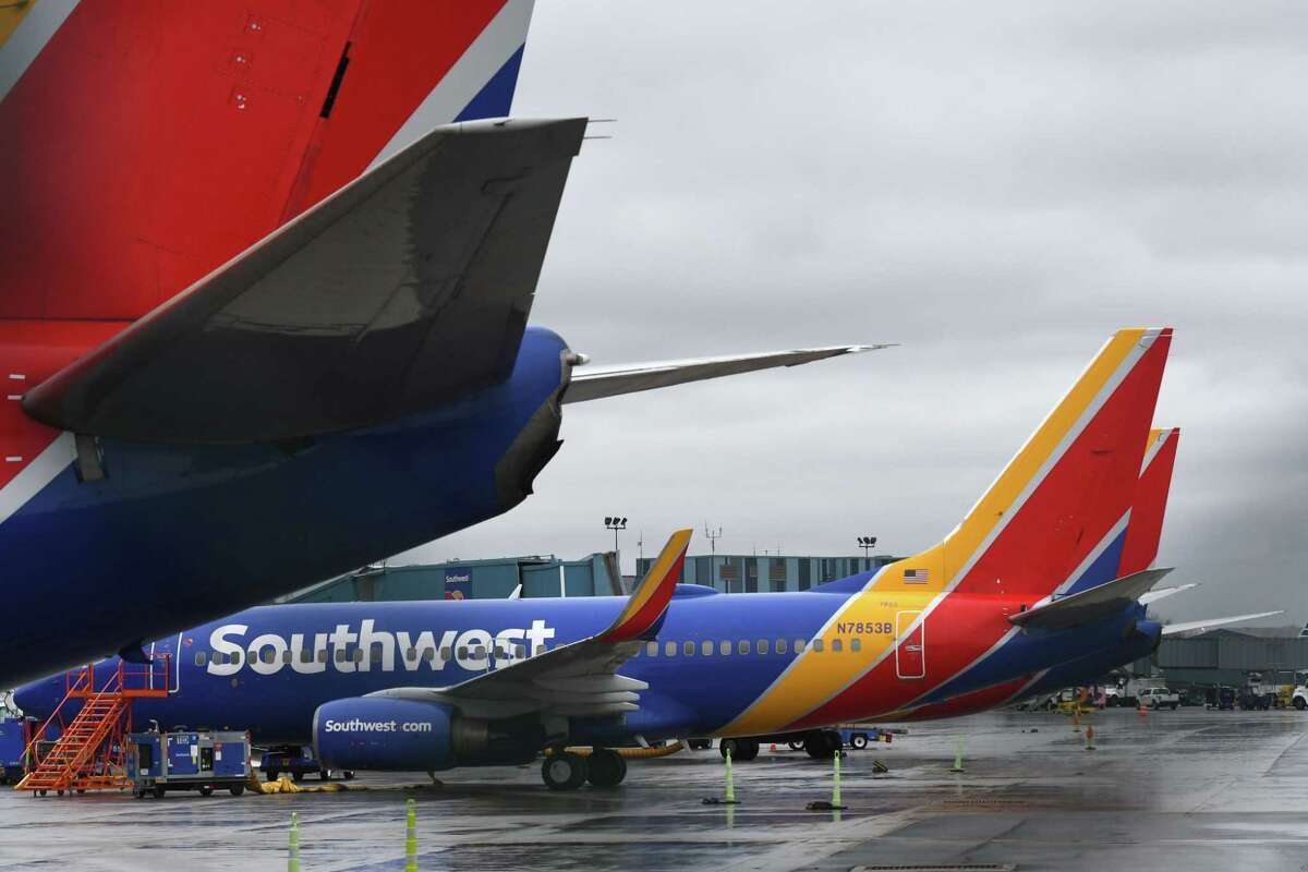Boeing 737 jets from Southwest Arlines are parked at Albany International Airport during the coronavirus outbreak on Monday, March 30, 2020, in Colonie N.Y. It's a sign that air travel won't return to normal for the foreseeable future. (Will Waldron/Times Union)