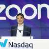 FILE - In this April 18, 2019 file photo, Zoom CEO Eric Yuan attends the opening bell at Nasdaq as his company holds its IPO in New York. Millions of people are now working from home as part of the intensifying fight against the coronavirus outbreak. Beside relying on Zoom, the video conference service, more frequently as part of their jobs, more people are also tapping it to hold virtual happy hours with friends and family banned from gathering in public places. (AP Photo/Mark Lennihan, File)