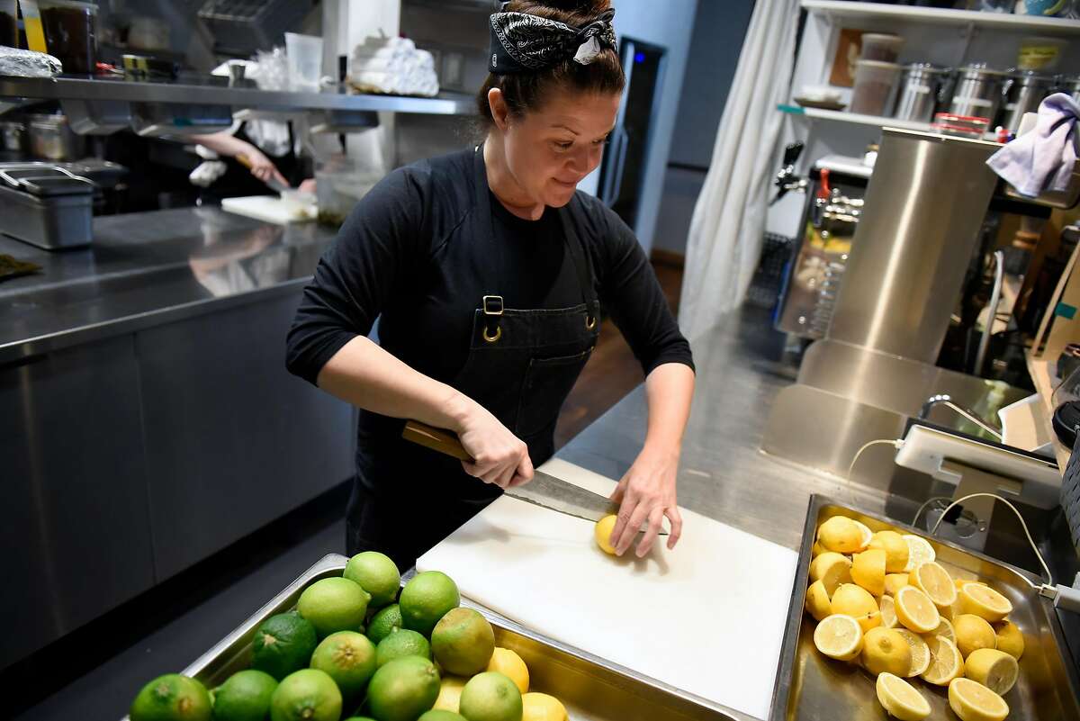 Head chef Kim Alter slices citrus that will be juiced and used for cocktails in the bar, at Nightbird restaurant in San Francisco, Calif., Friday March 30, 2018.