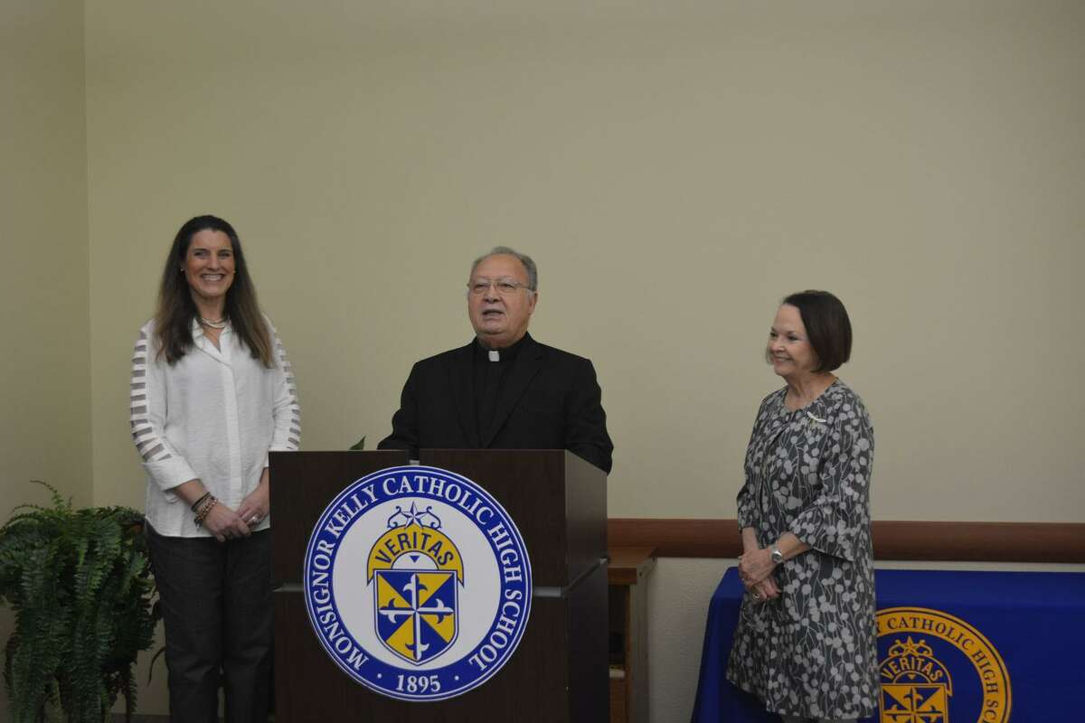 Bishop Curtis Guillory, SVD, announces Dr. Teresa Shaffer (left) as the new principal at Msgr. Kelly Catholic High School, Beaumont, as Marcia Stevens, Superintendent of Catholic Schools, looks on.