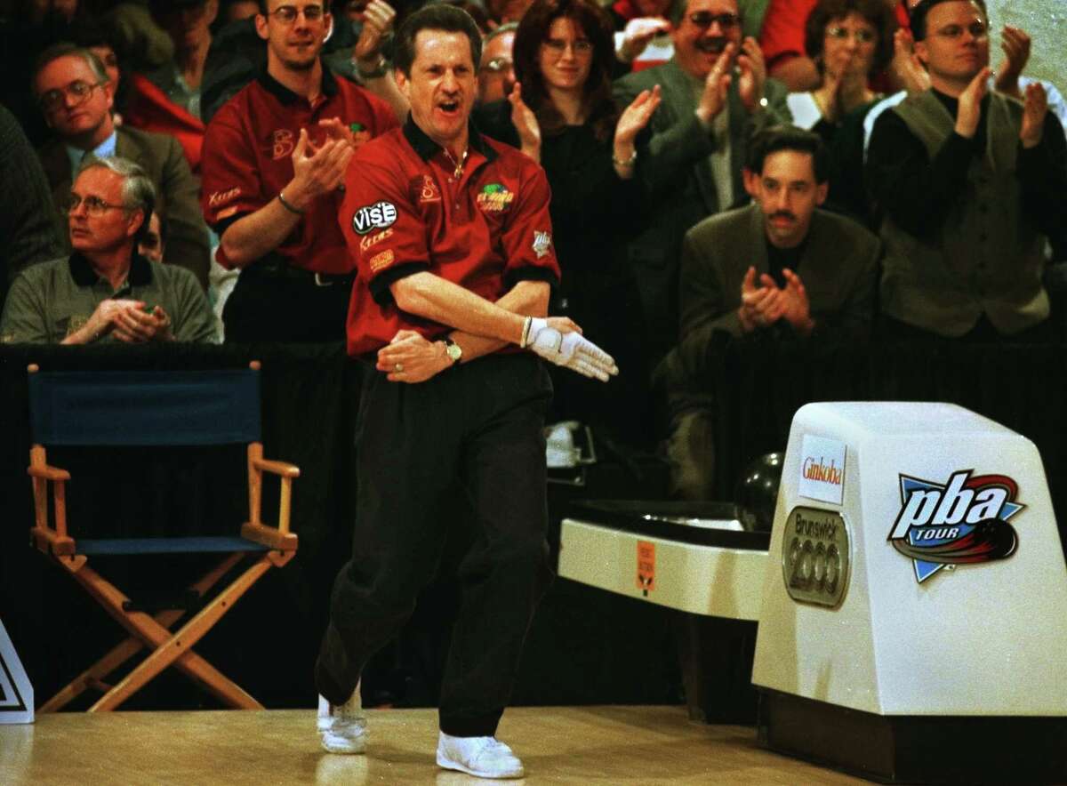 Times Union Staff Photo by Michael P. FARRELL -- Pete Weber , forms a strike mark with his hands after winning the PBA Parker Bohn III Empire State Open at the Bowlers Club in Latham Saturday Feb. 12. 2000.