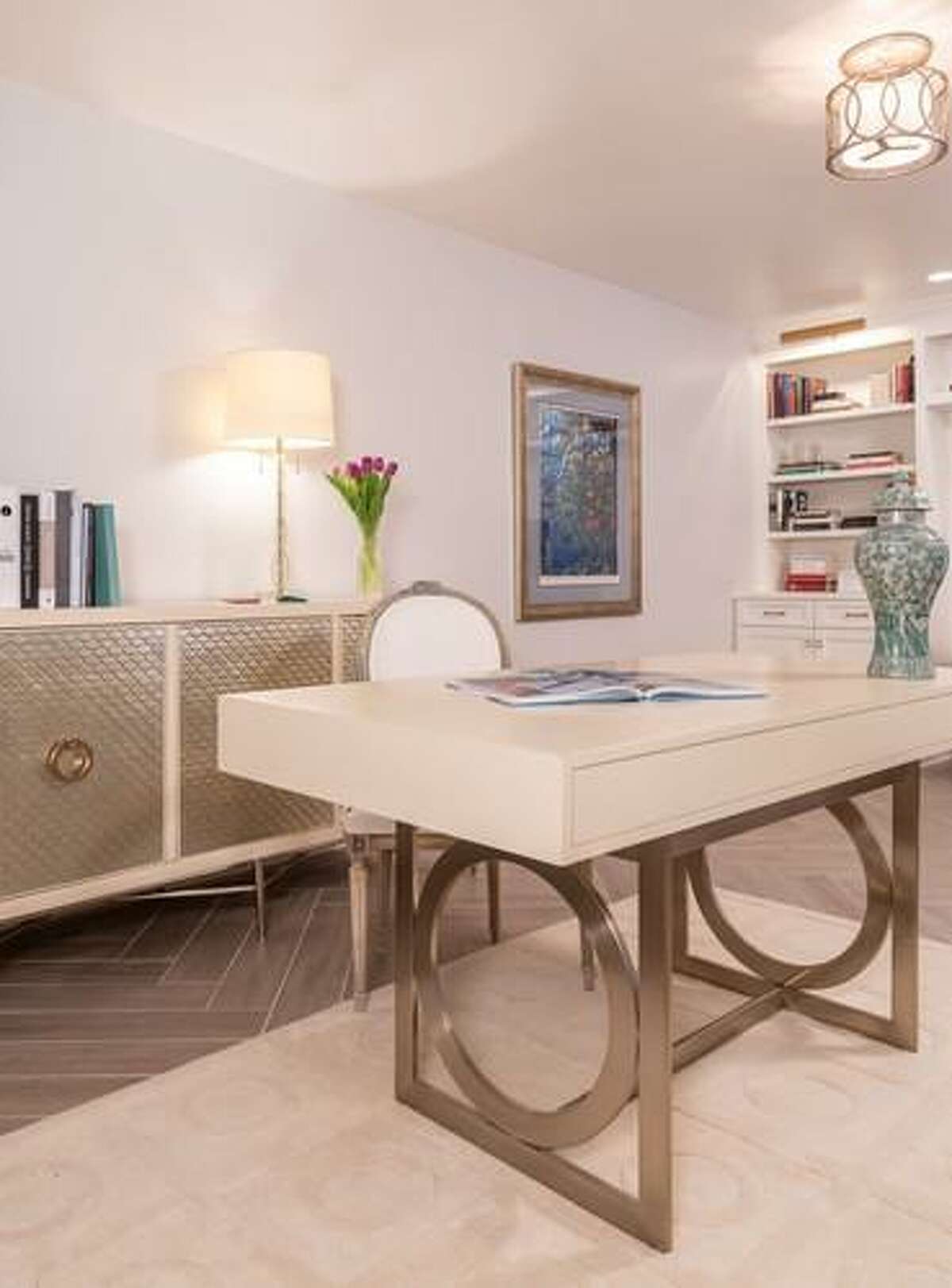 Sophia and Anthony Vassiliou share office space in their Nottingham Forest home. Sophia's half of the room has this functional desk and credenza.