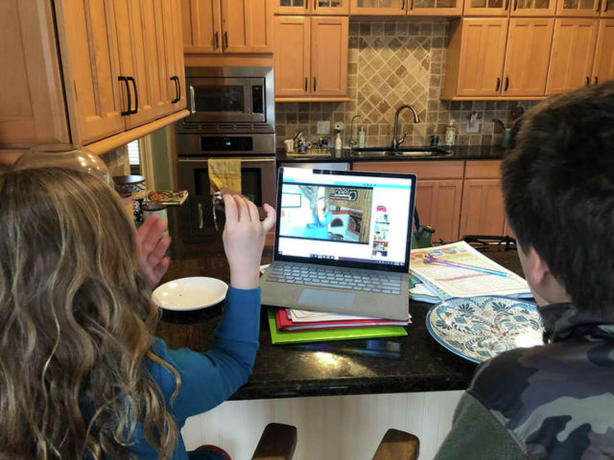 Children listen to a recent week’s virtual storytime via live stream from the Edwardsville Children’s Museum.